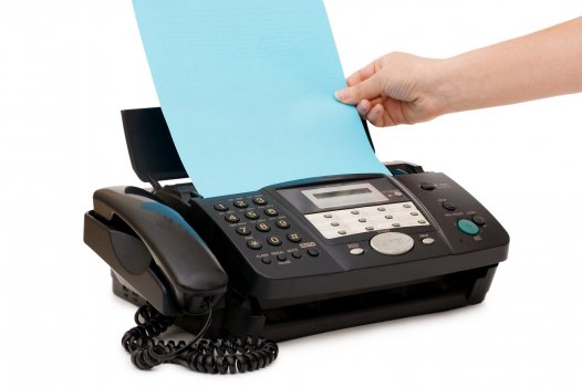 metrofax online fax services fax machine hand holding sheet